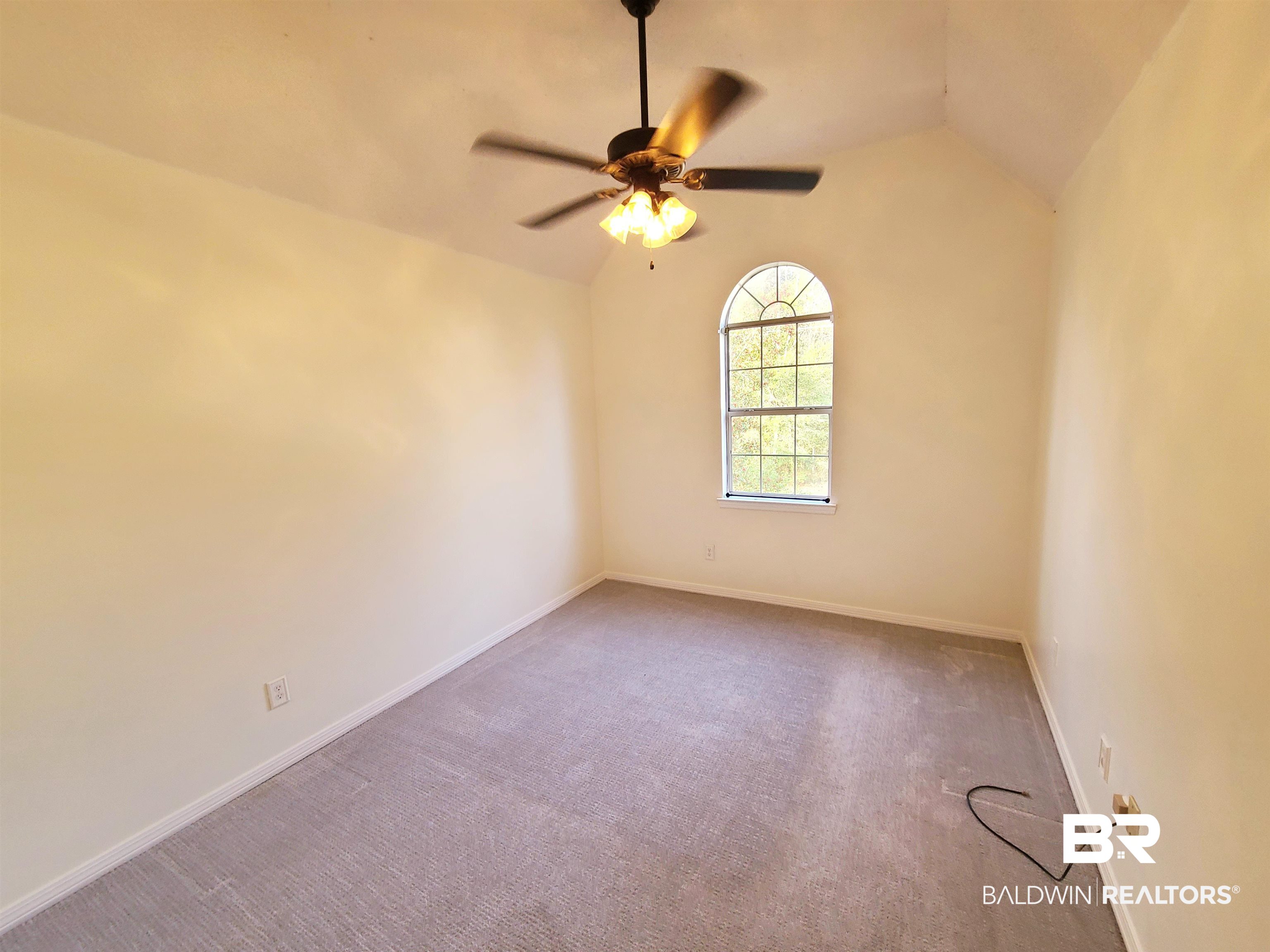 123 Melanie Loop Daphne, AL 36526 - Photo 15 of 17 Empty room with carpet flooring, a ceiling fan, and lofted ceiling
