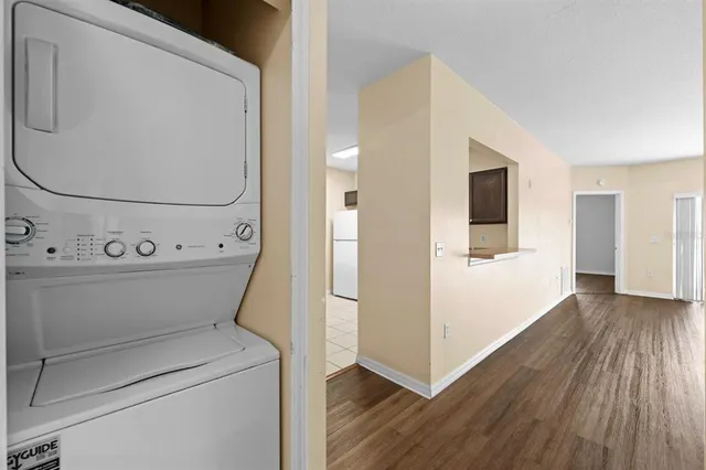 a view of washer and dryer with wooden floor