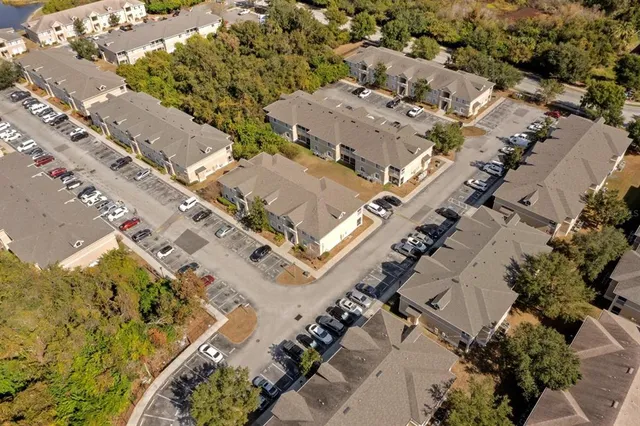 an aerial view of a house with a yard