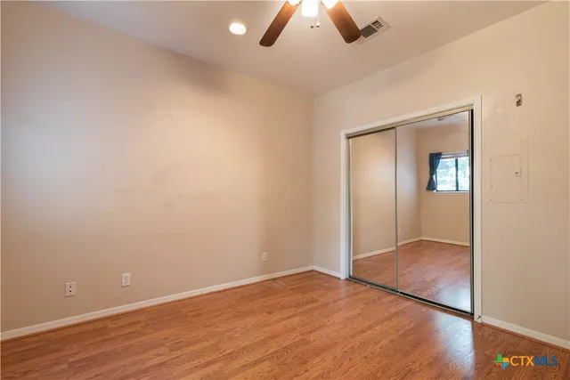 an empty room with fan