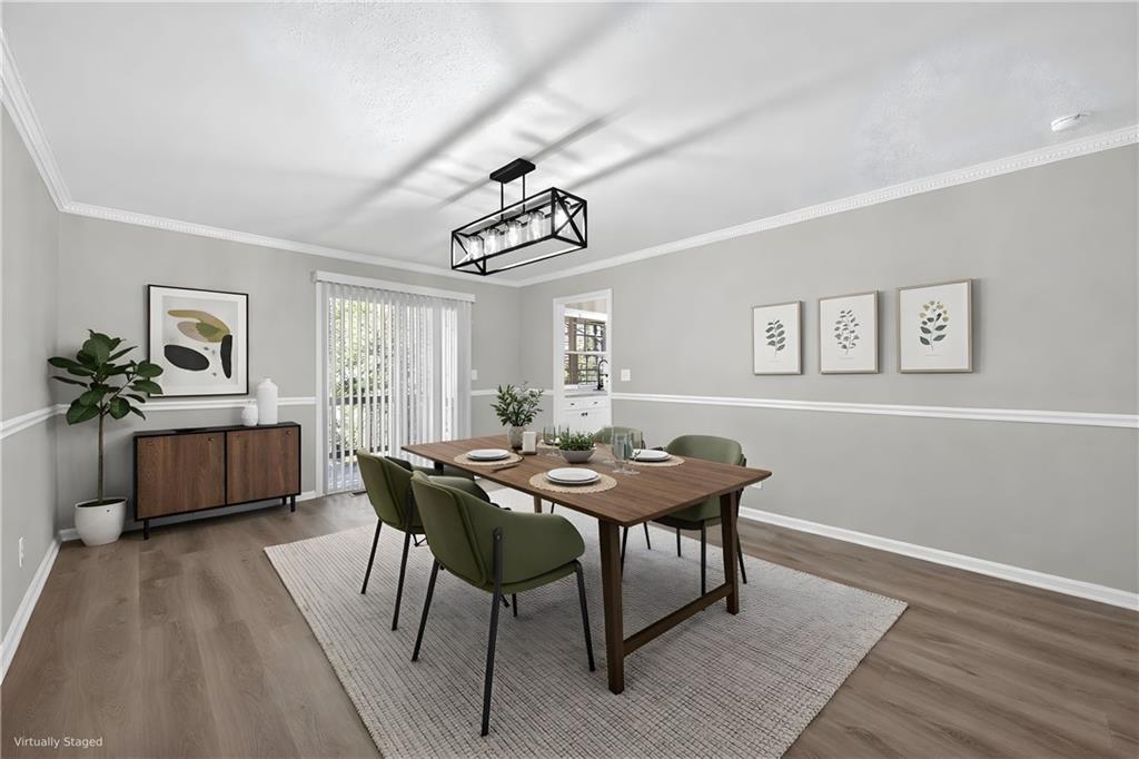 187 Old Timber Road Lawrenceville, GA 30046 - Photo 6 of 32 a view of a dining room with furniture window and wooden floor