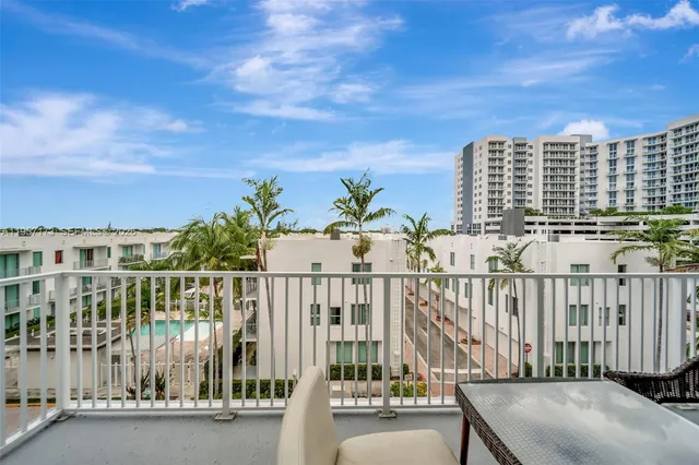 a view of balcony with furniture
