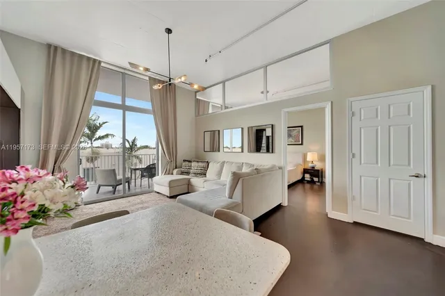 a living room with furniture and a window