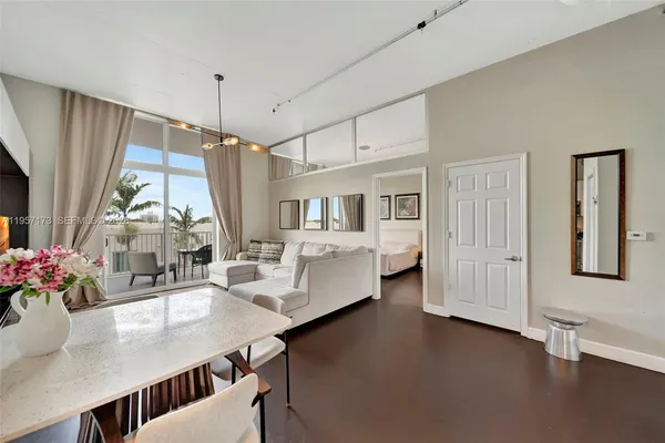 a dining room with furniture and window