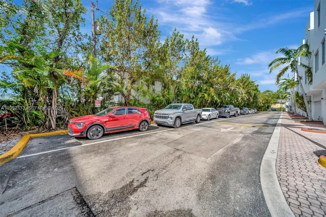 a view of a cars parked on the side of the road