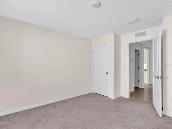 a view of a room with a hallway