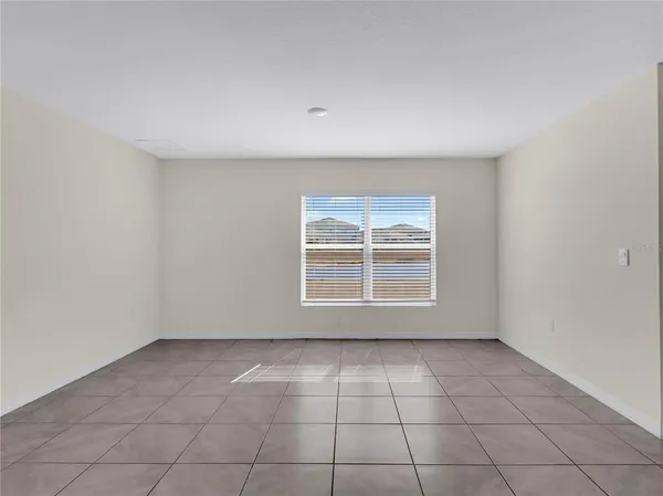 an empty room with a empty space and a window