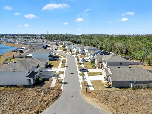 an aerial view of a house with a ocean view