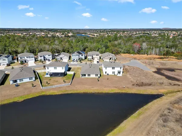 a view of a terrace with dining table and chairs