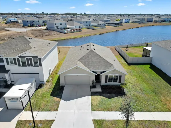 an aerial view of a house with outdoor space