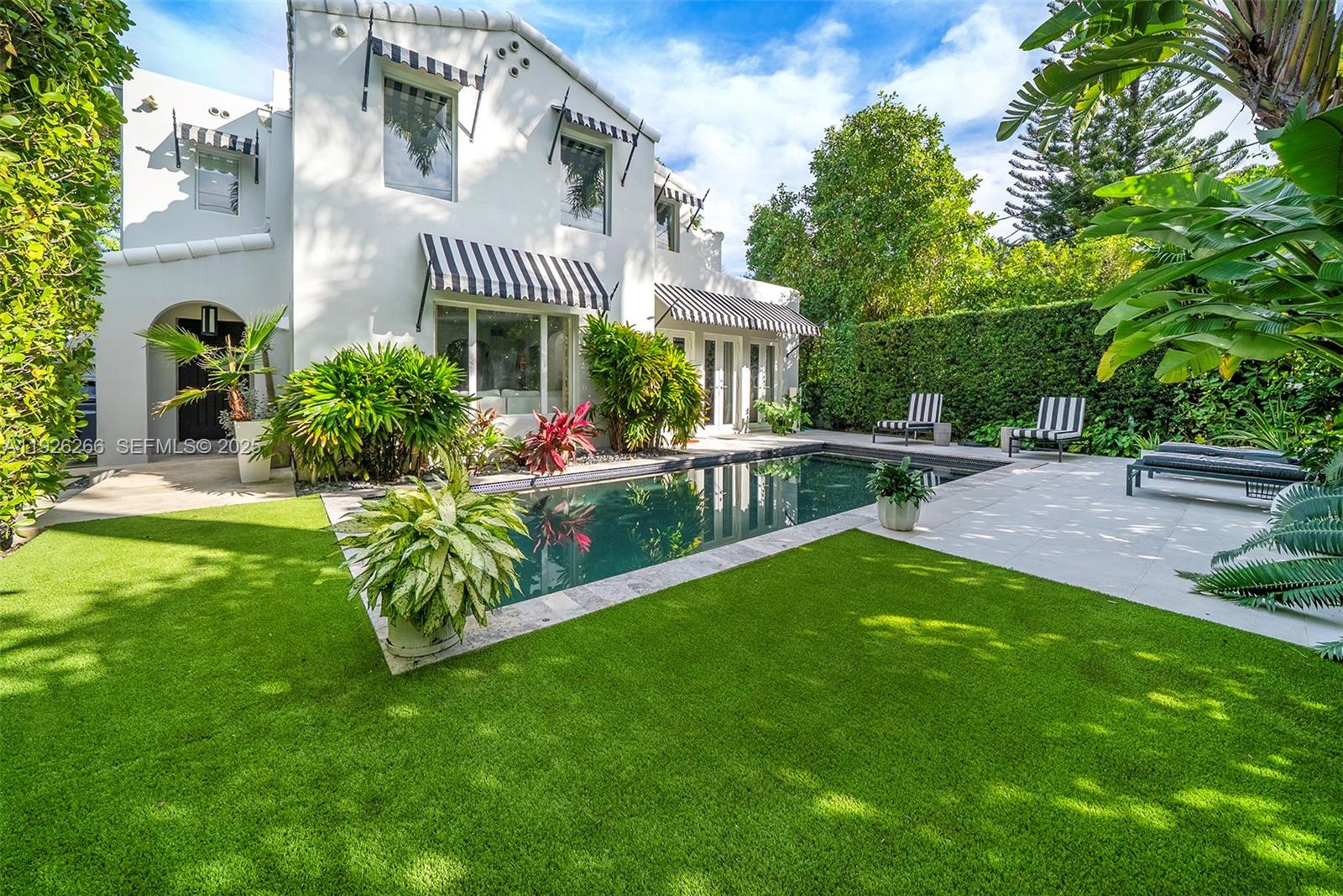 2729 North Bay Road Miami Beach, FL 33140 - Photo 13 of 41 a view of a house with a yard and sitting area