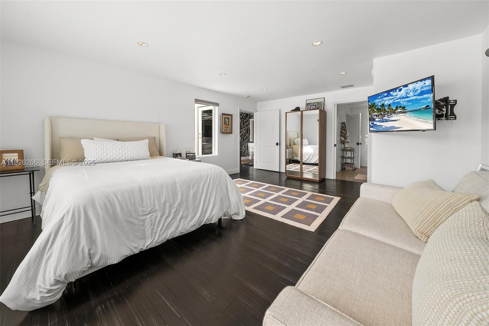 2729 North Bay Road Miami Beach, FL 33140 - Photo 28 of 41 a bedroom with a bed lamp on desk and a window