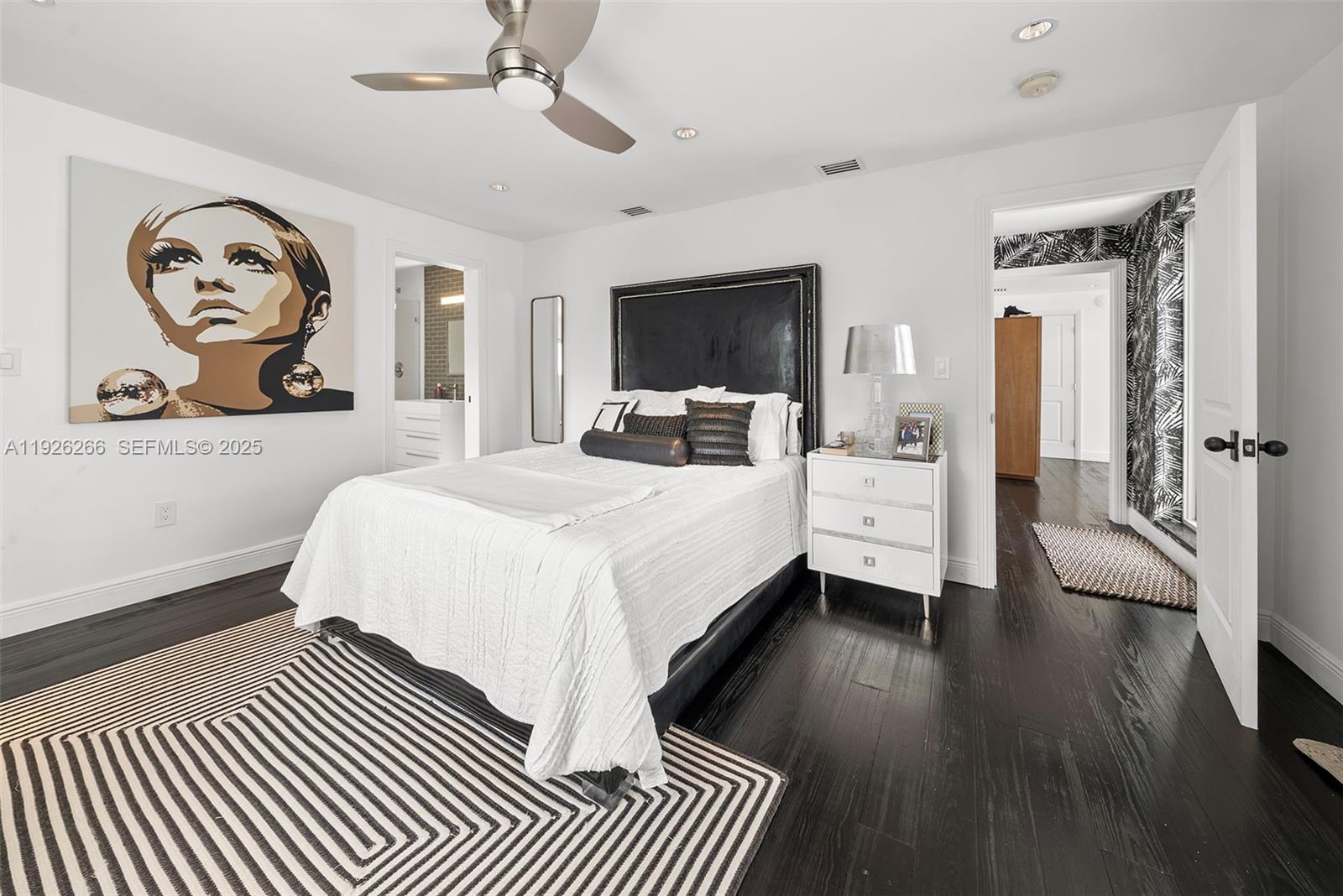 2729 North Bay Road Miami Beach, FL 33140 - Photo 31 of 41 a bedroom with a bed and a chandelier