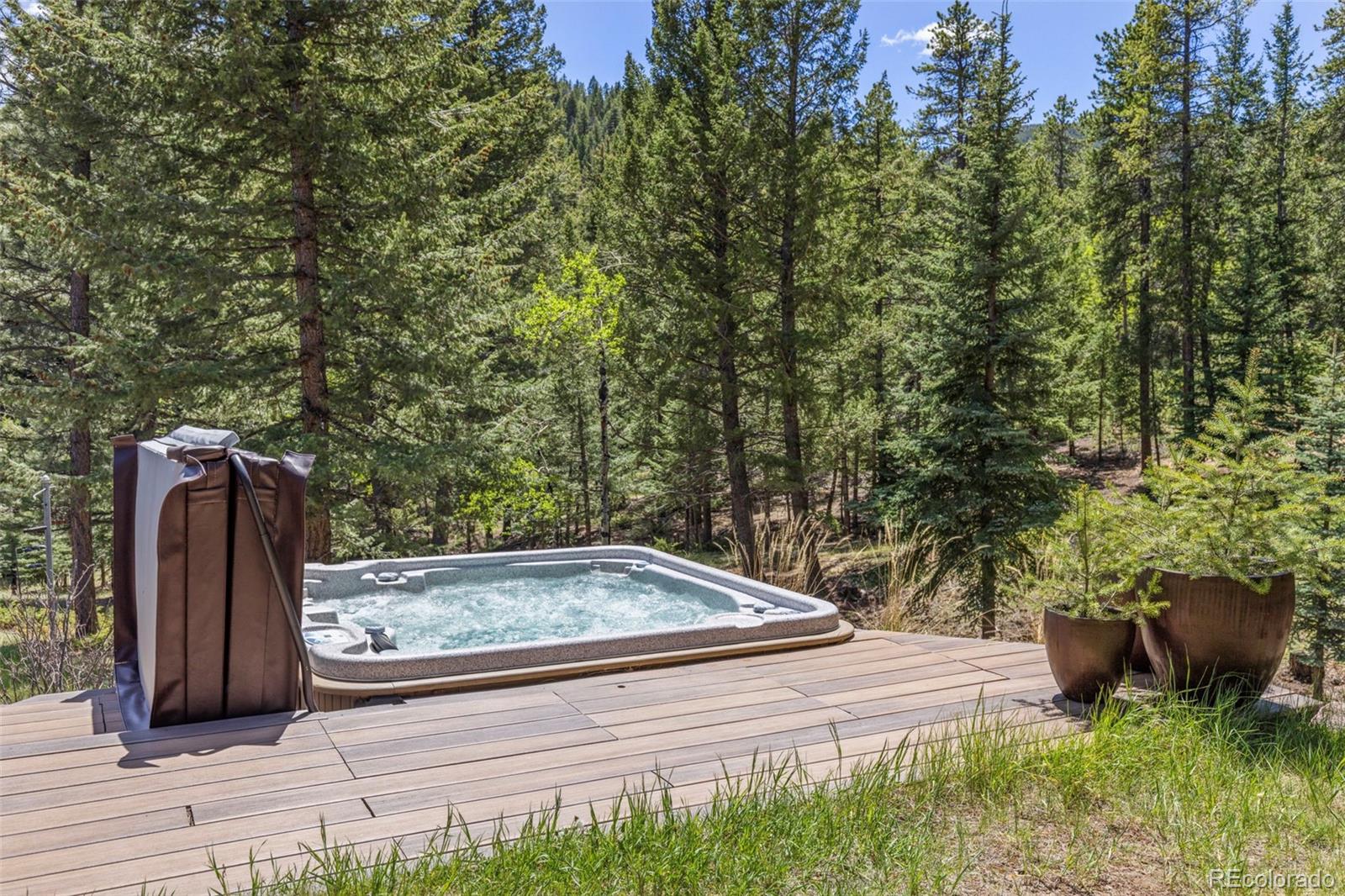 1323 South Snyder Gulch Road Evergreen, CO 80439 - Photo 39 of 47 a view of a backyard with sitting area
