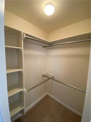 a spacious bathroom with a granite countertop sink and a mirror