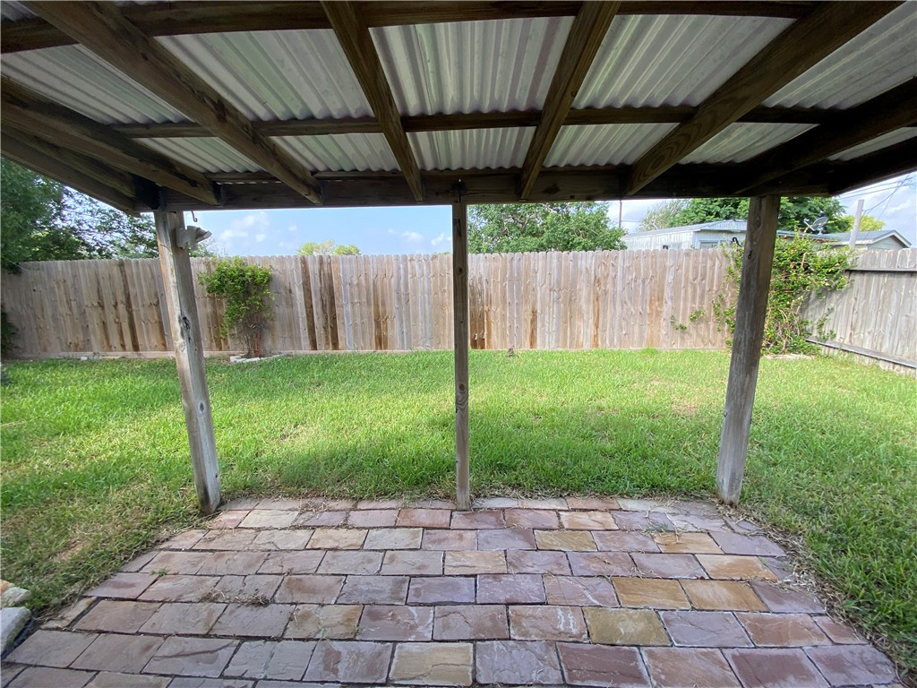 913 Strom Road Corpus Christi, TX 78418 - Photo 23 of 24 a view of a backyard with plants and a backyard