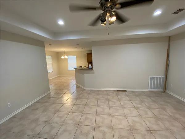 a kitchen with a sink a counter space cabinets and appliances