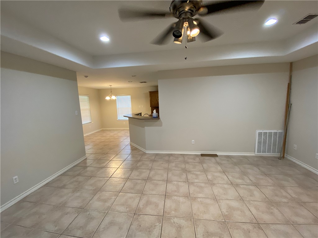 913 Strom Road Corpus Christi, TX 78418 - Photo 3 of 24 a view of a hallway with a chandelier