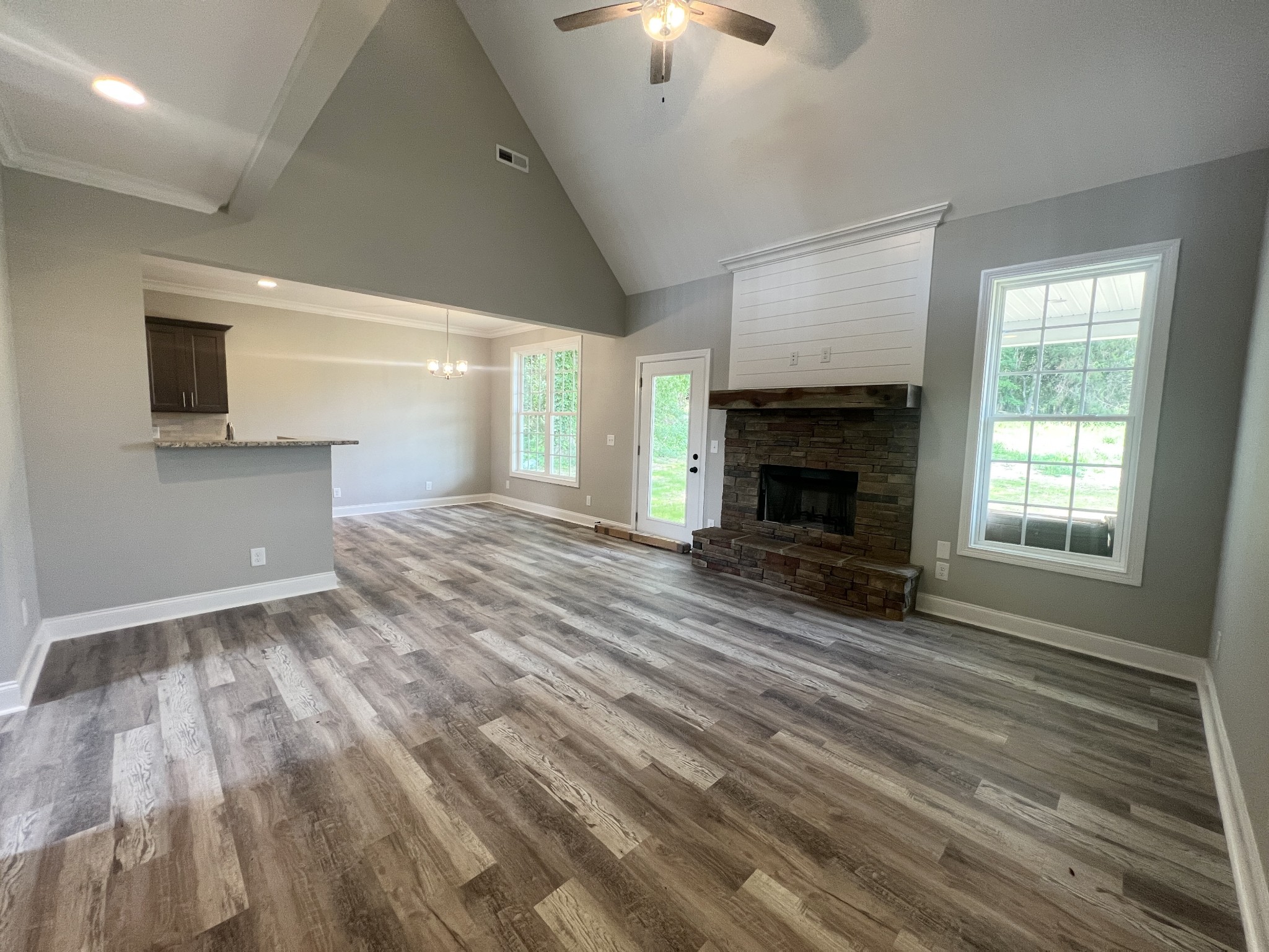 553 Hiwassee Road Lebanon, TN 37087 - Photo 3 of 19 wooden floor fireplace and natural light in room