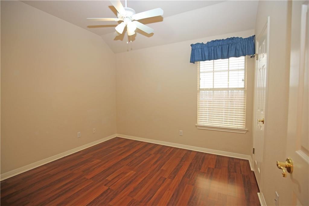 11616 Sweet Basil Court Austin, TX 78726 - Photo 13 of 18 an empty room with a window and wooden floor