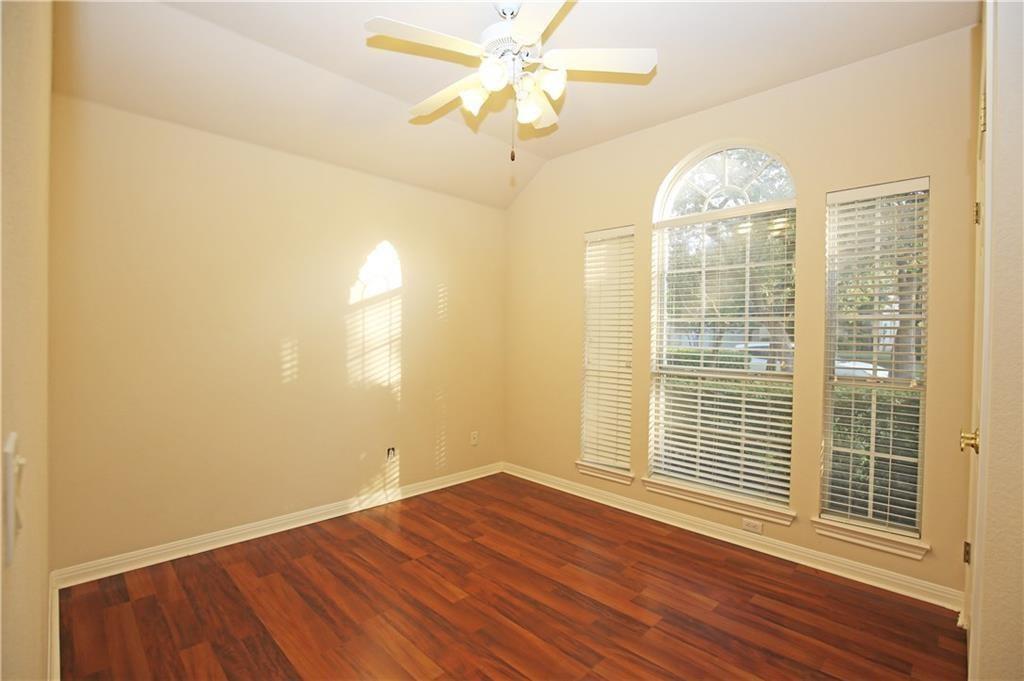 11616 Sweet Basil Court Austin, TX 78726 - Photo 14 of 18 a view of a livingroom with wooden floor and a ceiling fan