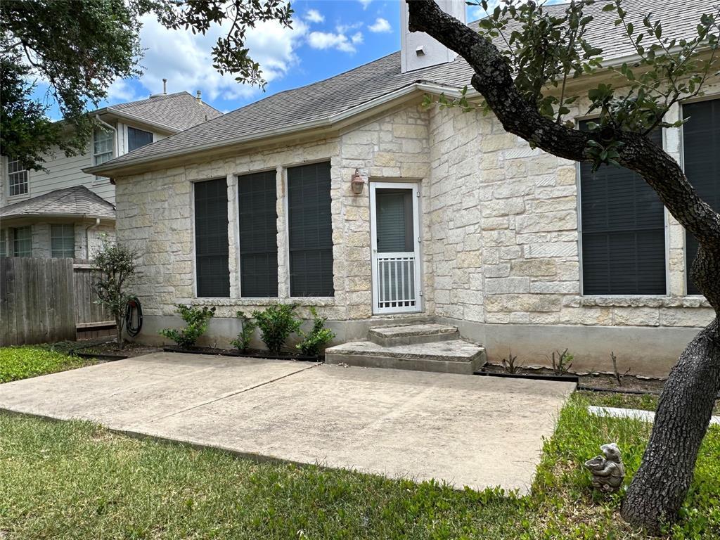 11616 Sweet Basil Court Austin, TX 78726 - Photo 16 of 18 a front view of a house with a yard