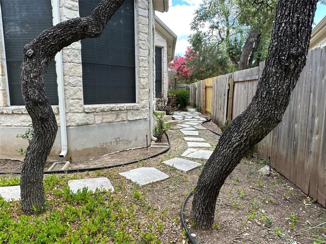 a view of yard with patio