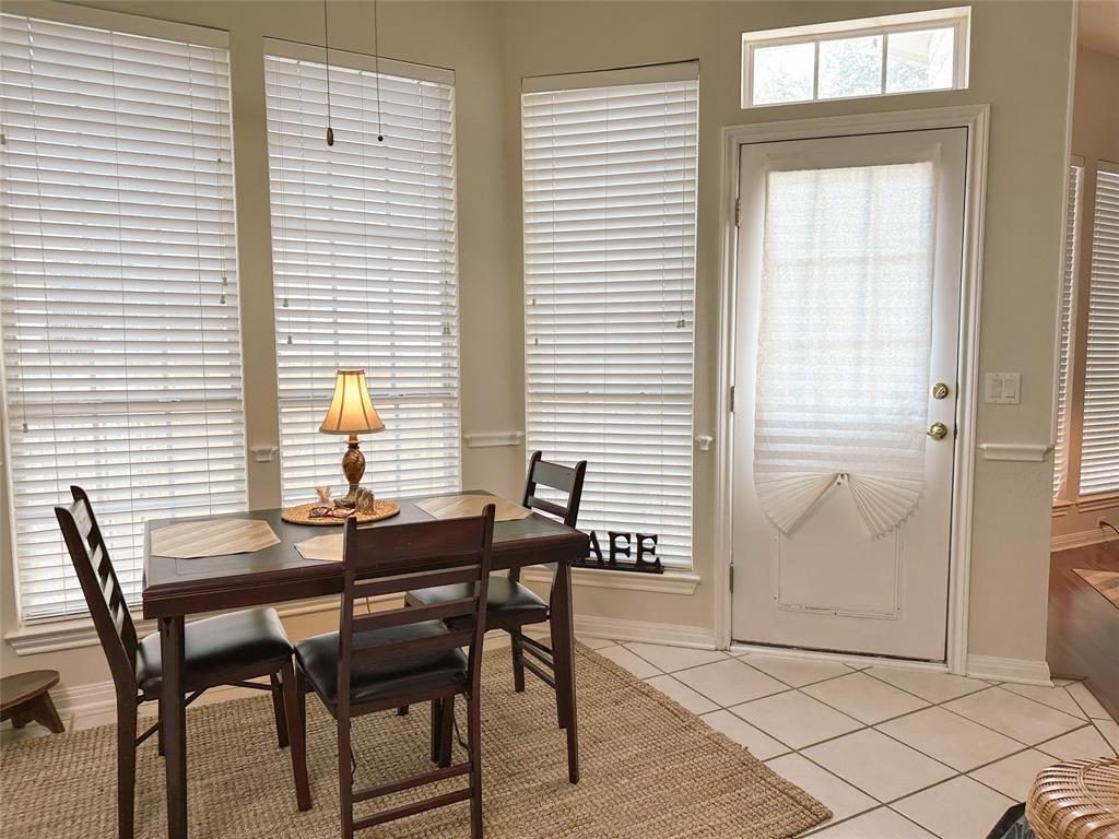 11616 Sweet Basil Court Austin, TX 78726 - Photo 9 of 18 a view of a dining room with furniture and window