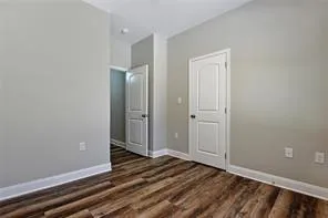 a view of a livingroom with wooden floor and closet