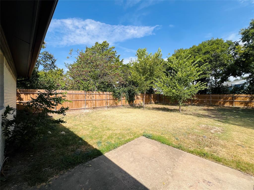 1621 Running River Road Garland, TX 75044 - Photo 17 of 20 a view of yard with swimming pool
