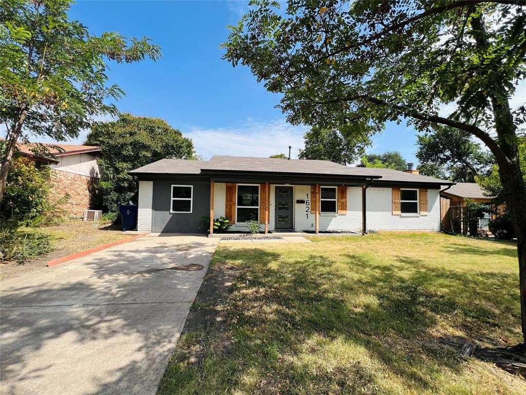 1621 Running River Road Garland, TX 75044 - Photo 2 of 20 front view of a house with a yard