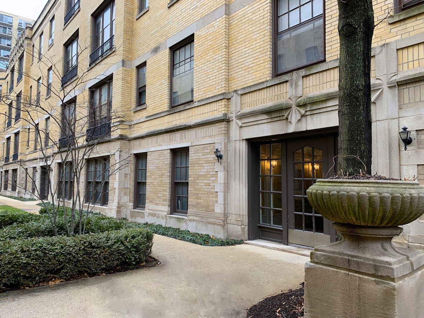 a front view of a brick building with a large windows