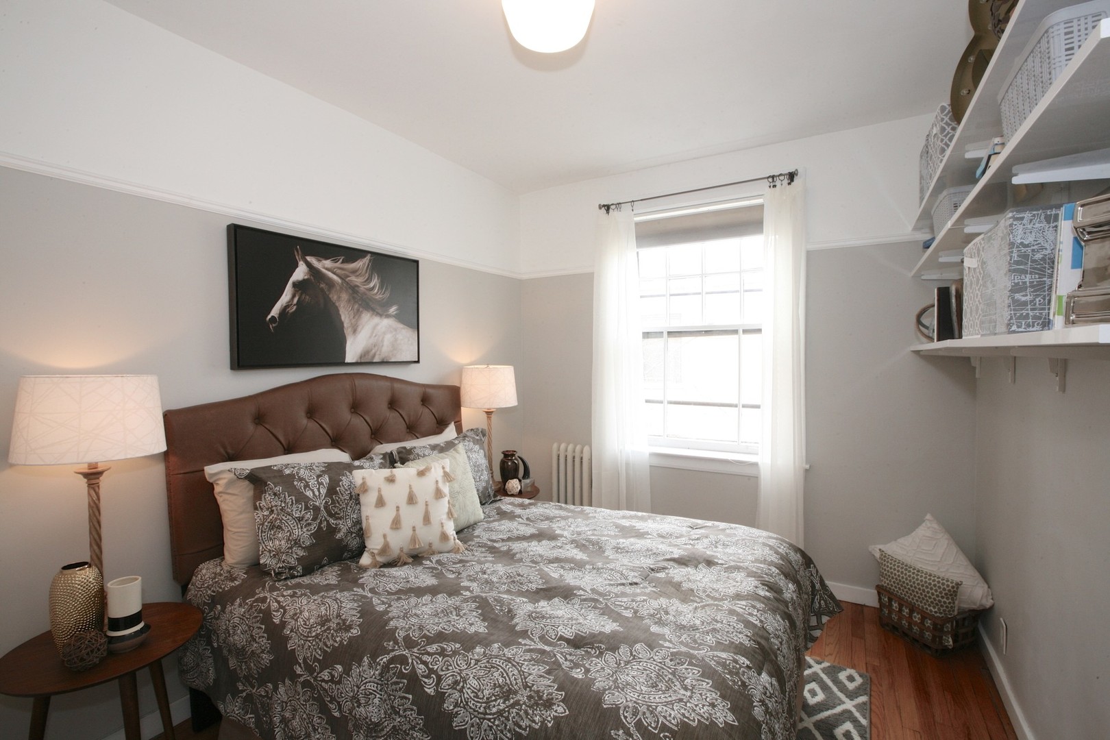 438 West Surf Street, Unit 3B Chicago, IL 60657 - Photo 17 of 36 a large bed sitting in a bedroom next to a window