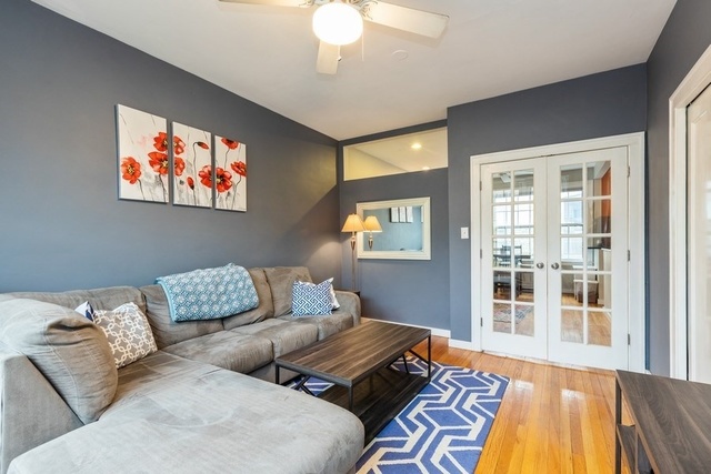 438 West Surf Street, Unit 3B Chicago, IL 60657 - Photo 28 of 36 a bedroom with furniture and a window