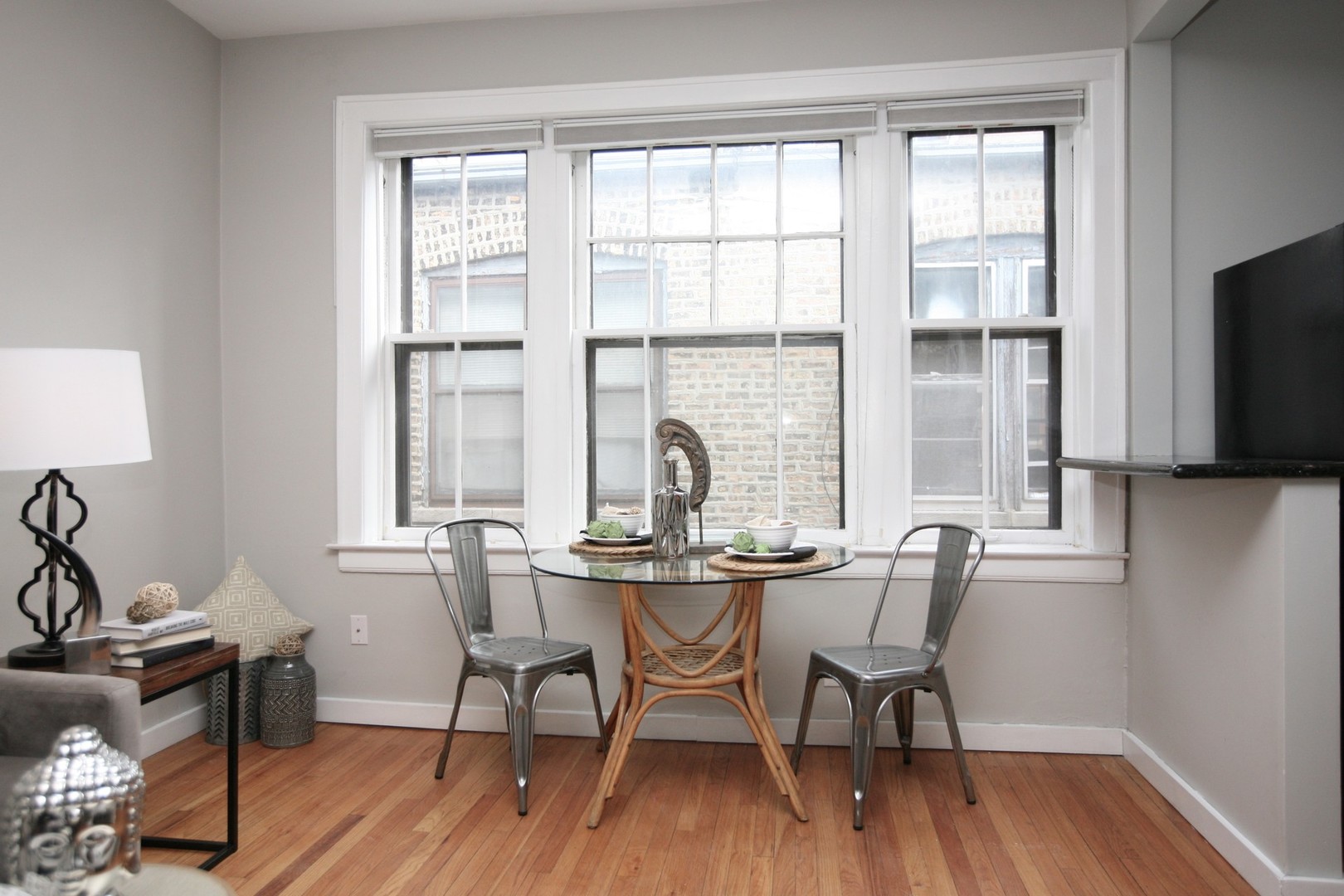 438 West Surf Street, Unit 3B Chicago, IL 60657 - Photo 7 of 36 a view of a dining room with furniture window and outside view