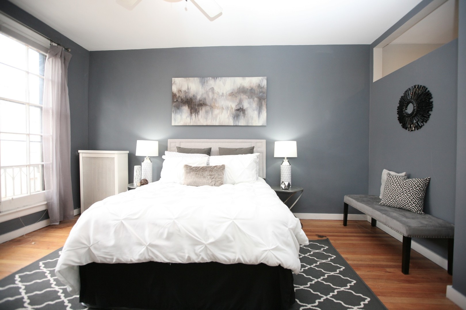 438 West Surf Street, Unit 3B Chicago, IL 60657 - Photo 10 of 36 a bedroom with a bed and wooden floor
