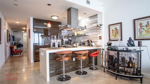 a view of a balcony with furniture and a stove