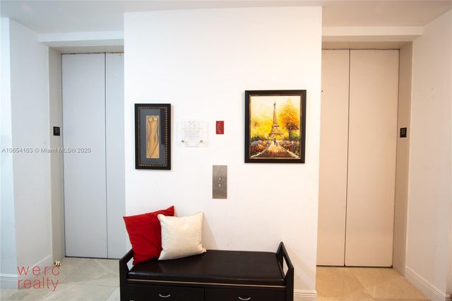 a bedroom with a bed and a table