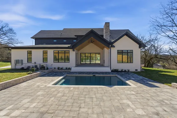 a front view of a house with swimming pool