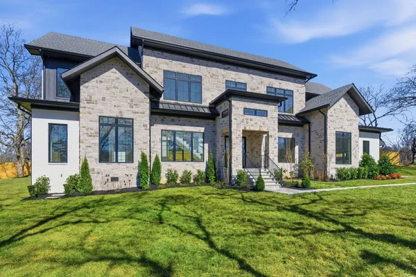a front view of a house with a yard