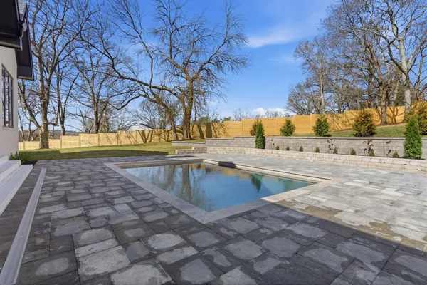 a view of swimming pool with a yard