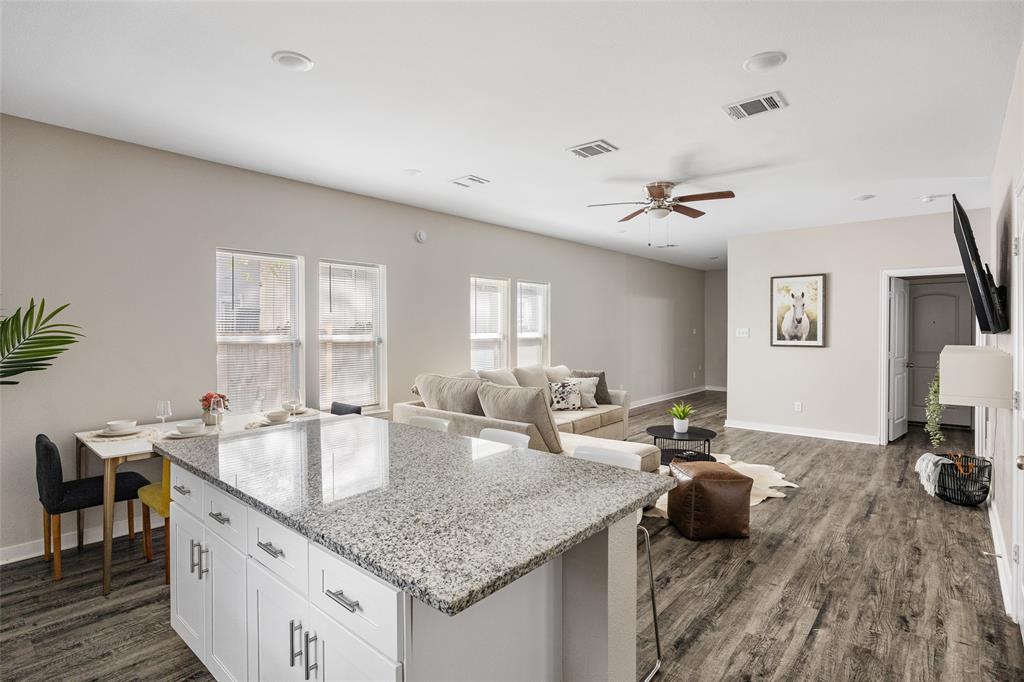 5006 Colonial Avenue Dallas, TX 75215 - Photo 12 of 25 a kitchen with sink refrigerator and stove