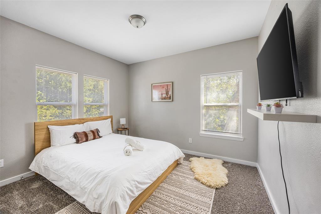 5006 Colonial Avenue Dallas, TX 75215 - Photo 15 of 25 a bedroom with a bed and a window