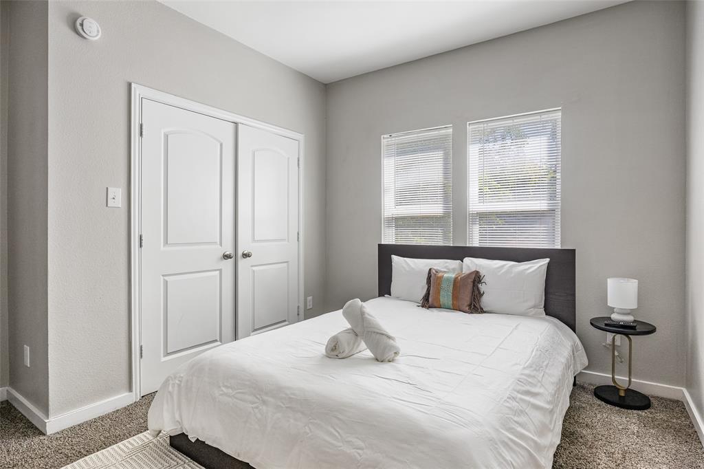 5006 Colonial Avenue Dallas, TX 75215 - Photo 20 of 25 a bedroom with a bed and a window