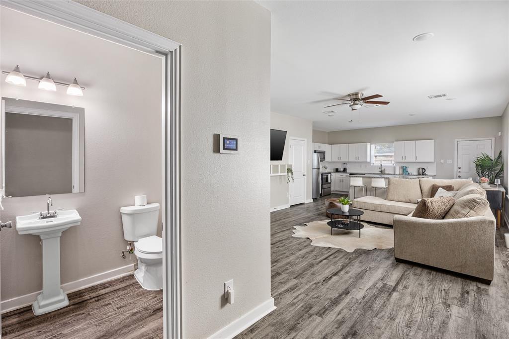 5006 Colonial Avenue Dallas, TX 75215 - Photo 2 of 25 a living room with furniture and a wooden floor