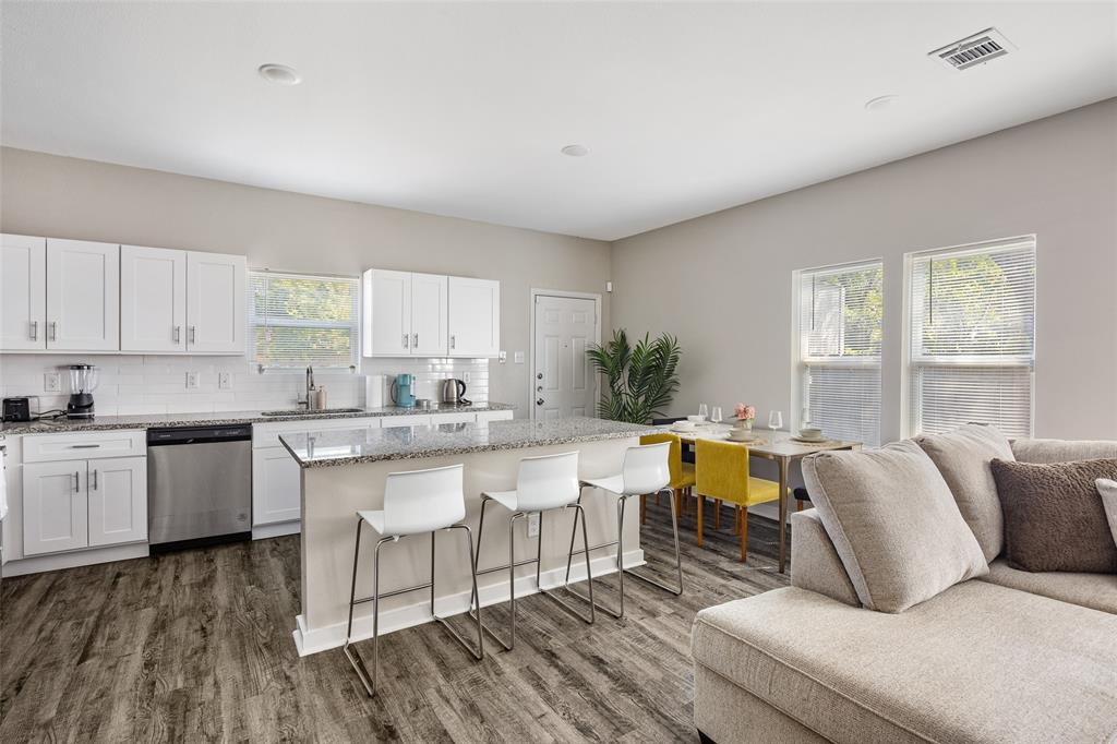5006 Colonial Avenue Dallas, TX 75215 - Photo 6 of 25 a living room with furniture and a large window