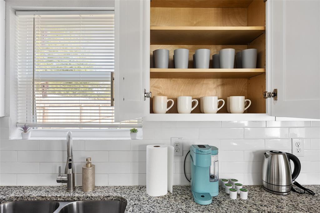 5006 Colonial Avenue Dallas, TX 75215 - Photo 10 of 25 a bathroom with a sink and a window
