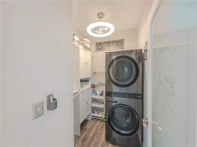 a large kitchen with stainless steel appliances granite countertop a lot of counter space and a sink