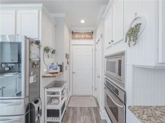 a bedroom with a large bed and a tv