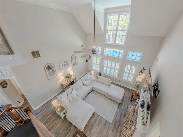 a white toilet sitting next to a shower